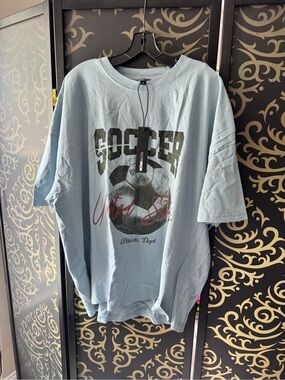 Fashion Nova Light Blue Soccer Graphic Short Sleeve Tee